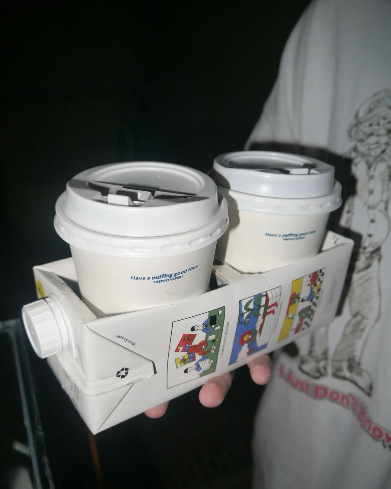 Takeaway coffee cups in a carrier