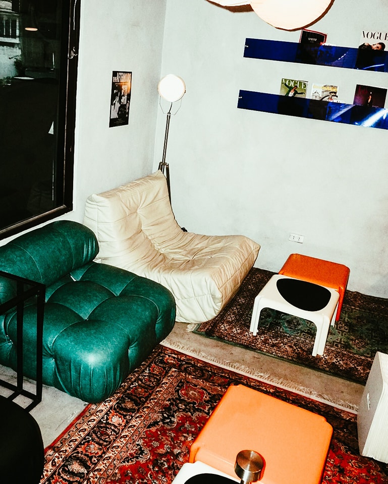 PUFF Coffee Club interior with vintage chairs and magazines